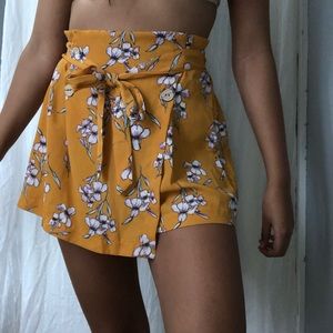 mustard yellow skort with flower designs that ties
